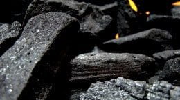 A close up of a pile of coal, highlighting the critical issues of carbon pricing.
