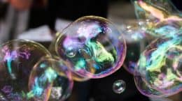 A group of soap bubbles, innovating climate perceptions, floating in the air.